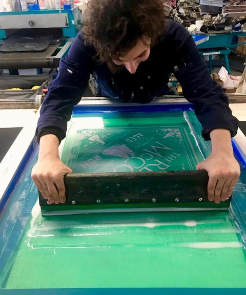 Image of artisan screen printing Real McCoy Rum Bandanas