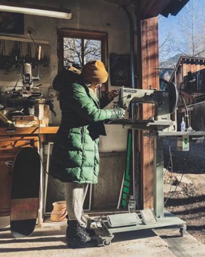 Image of artisan sewing leather in Telluride Colorado